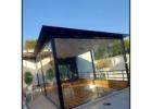 Modern Living Redefined with Elegant Glass House Design