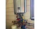 Expert Installing a Tankless Water Heater for Energy-Efficient Hot Water